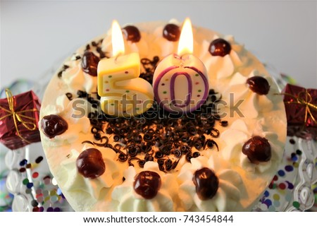An image of a birthday cake with candle - 50