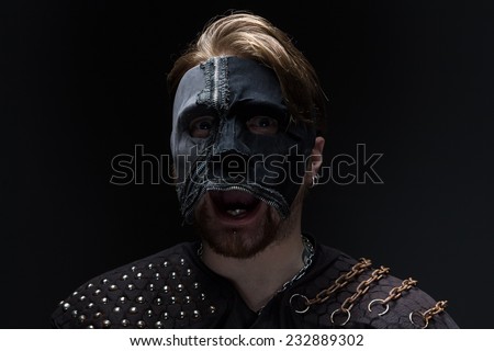 Image of the blond man in mask on black background