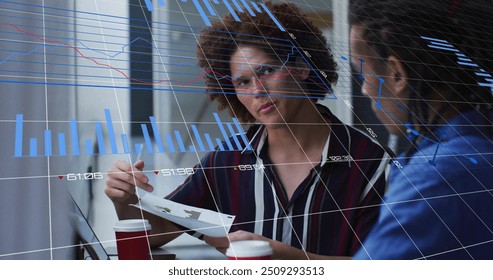 Image of blue charts processing data over diverse male colleagues talking at casual office. Business, connection, teamwork, digital interface and communication, digitally generated image.