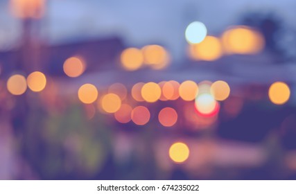 image of blur restaurant or cafe on night time with  light bokeh for background usage . (vintage tone) - Shutterstock ID 674235022