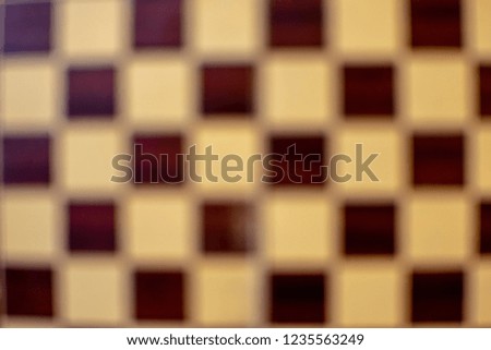 Image of a blurred chess background.Abstract concept.