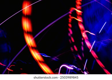 The image is a blurry, colorful representation of a roller coaster. The bright colors and blurred lines create a sense of motion and excitement, evoking the feeling of being on a roller coaster - Powered by Shutterstock