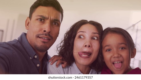 Image of bokeh over happy biracial family making funny faces. family, relationship and spending quality time together concept digitally generated image. - Powered by Shutterstock