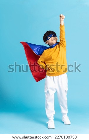 The image of a boy wearing a cape transforms into a hero