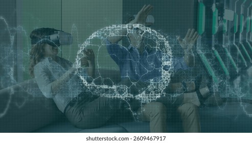 Image of brain scan and medical data processing on interface, over man and woman in vr headsets. global medical research technology and digital interface concept, digitally generated image.