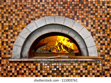  Image Of A Brick Pizza Oven With Fire