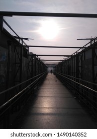 An image of bridge with sun