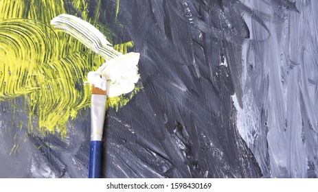 Image of brush on ongoing or under progress abstract paintings
