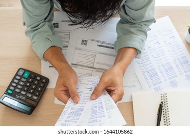 Image Of A Business Man With Financial Concerns. Think Hard About Paying Off Credit Card Debt, House Rent, And Family Expenses. Financial Problem Concept