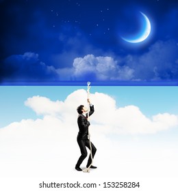 Image Of Businessman Pulling Banner With Illustration. Day And Night Concept