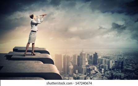 Image of businesswoman looking in telescope standing a top of building - Powered by Shutterstock