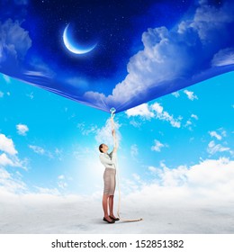 Image Of Businesswoman Pulling Banner With Illustration. Day And Night Concept