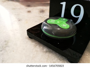 Image Of Restaurant  Or Cafe Buzzer System To  Let Customers Communicate With Waiters On Food And Drinks Orders. Focus On Buzzer Button Only.