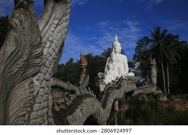 The image captures the Five Buddhas statues at Wat Nong Chik, a temple located in the Khao Khram subdistrict of Krabi, Thailand.