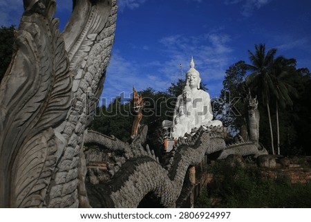 The image captures the Five Buddhas statues at Wat Nong Chik, a temple located in the Khao Khram subdistrict of Krabi, Thailand.