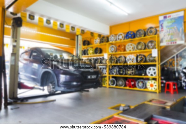 Image of a car\
repair garage in lens blur\
effect