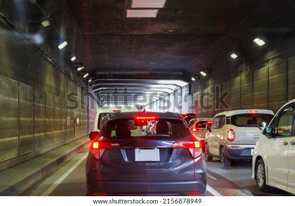 Image of a car stuck in a\
tunnel