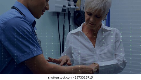 Image of cardiograph over biracial male doctor examining his patient. Technology, medicine and digital interface concept digitally generated image. - Powered by Shutterstock - Get 15% off with code: PIKWIZARD15