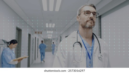 Image of cardiograph over caucasian male doctor walking in hospital. Technology, medicine and digital interface concept digitally generated image. - Powered by Shutterstock - Get 15% off with code: PIKWIZARD15