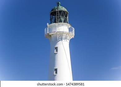 Image of the castle point lighthouse on the beach located in north island of new zealand. Tourist popular attraction/landmark in Wairarapa area. Spaces for your text.