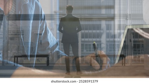 Image of caucasian businessman walking over businessman writing. Global business and digital interface concept digitally generated image. - Powered by Shutterstock