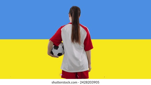 Image of caucasian female soccer player over flag of ukraine. Global sport, patriotism and digital interface concept digitally generated image. - Powered by Shutterstock