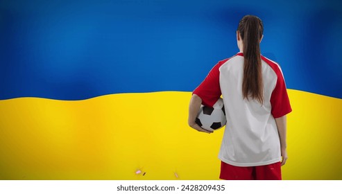 Image of caucasian female soccer player over flag of ukraine. Global sport, patriotism and digital interface concept digitally generated image. - Powered by Shutterstock