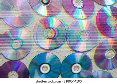 Image of cd's with glitch effect, retro wallpaper, futuristic, color effect.