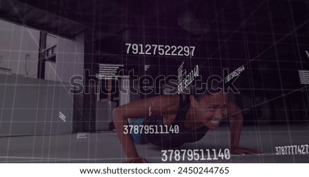 Image of changing numbers over african american fit woman preforming push up exercise. Sports and fitness technology concept