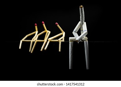 Image Of A Character Made Of Cigarette, With Matchsticks Next To It, On Black Background. Concept Of Bad Company. We Are Friends, A Toxic Friendship.