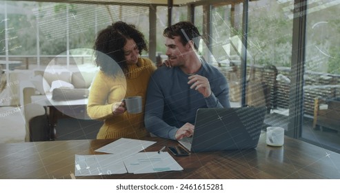 Image of charts and data processing over happy biracial couple using laptop at home. business, global communication and digital interface technology concept digitally generated image. - Powered by Shutterstock - Get 15% off with code: PIKWIZARD15