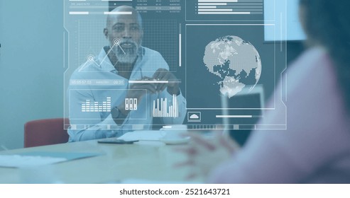 Image of charts processing data over happy diverse colleagues talking at office. Digital interface, network, connection, business and global communication, digitally generated image.