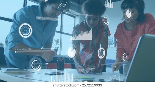 Image of charts processing data over diverse colleagues brainstorming at casual office. Business, teamwork, network, digital interface and global communication, digitally generated image.