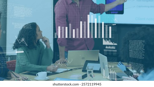 Image of charts processing data over colleagues at casual office meeting. Business, teamwork, network, digital interface and global communication, digitally generated image.
