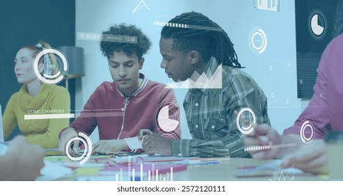 Image of charts processing data over diverse male colleagues talking at casual office meeting. Business, teamwork, network, digital interface and global communication, digitally generated image.