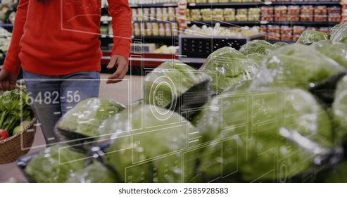 Image of charts and processing data over happy biracial woman grocery shopping. Connection, food, nutrition, healthy lifestyle, digital interface and communication, digitally generated image.