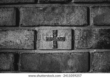 image of a Christian cross in a brick wall, religious procession, black and white photo