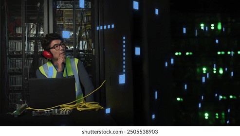 Image of circuit board and data processing over asian male it engineer by computer servers. Global business, connections, computing and data processing concept digitally generated image.