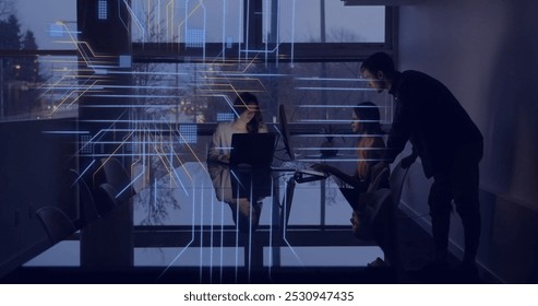 Image of circuit board with data processing over diverse people in office with laptops. Global connections, computing, digital interface and data processing concept digitally generated image.