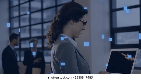 Image of circuit board with data processing over caucasian woman using laptop. Global connections, computing, digital interface and data processing concept digitally generated image.