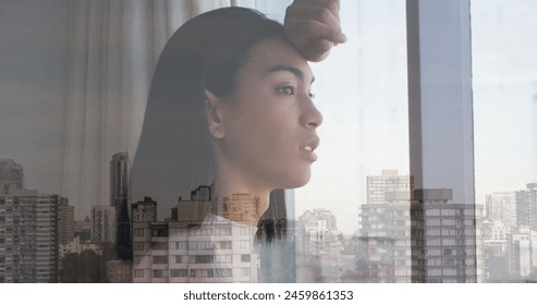 Image of cityscape over biracial woman looking through window. Lifestyle, fashion and light concept digitally generated image. - Powered by Shutterstock