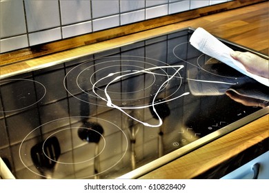 An image of cleaning a hob (Stove)