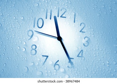 an image of a clock on waterdrop background