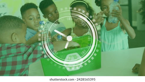 Image of clock over diverse schoolchildren recycling plastic in class. Ecology, school, education, childhood and learning, digitally generated image. - Powered by Shutterstock