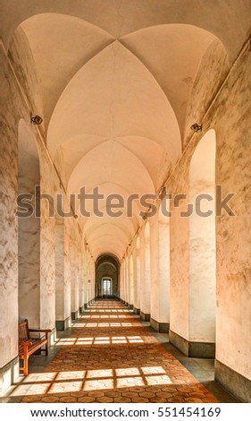 Image of the cloister arches inside a monastery. Architectural background.