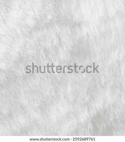 The image is a close up of a white fur texture. The fur is very soft and fluffy, giving the impression of a cozy and comfortable feeling. The texture is so fine that it almost looks like a dreamy