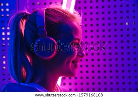 Similar – Young DJ woman in a night party