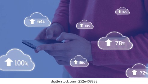 Image of cloud symbols uploading data over midsection of caucasian man using smartphone. Communication, data sharing, networking, digital interface and technology, digitally generated image.