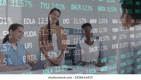 Image of cloud text in cloud, trading board, diverse coworkers discussing and shaking hands. Digital composite, cloud computing, stock market, business, teamwork and technology concept. - Powered by Shutterstock