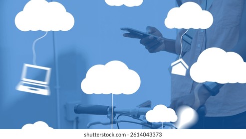 Image of clouds with electronic devices over caucasian man using smartphone. global cloud computing, digital interface and data processing concept digitally generated image.